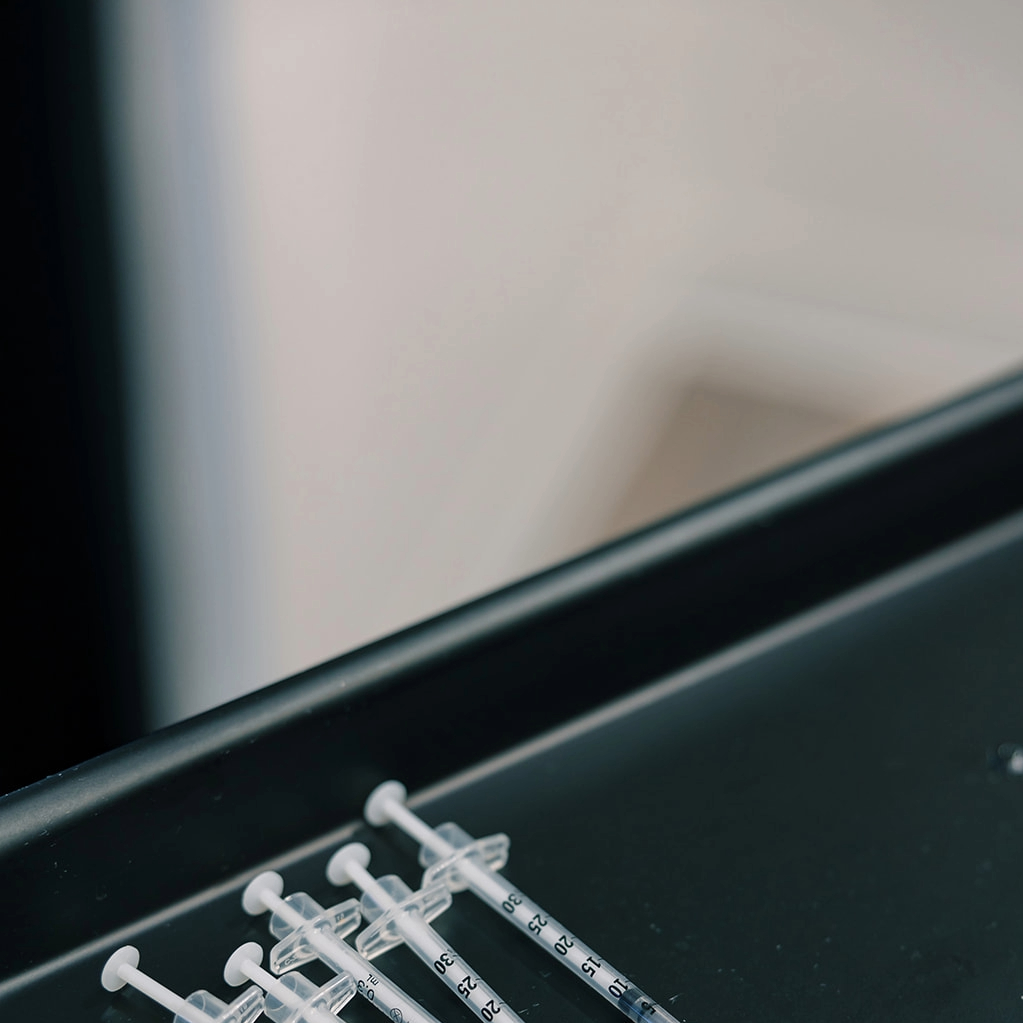 syringes in a black tray